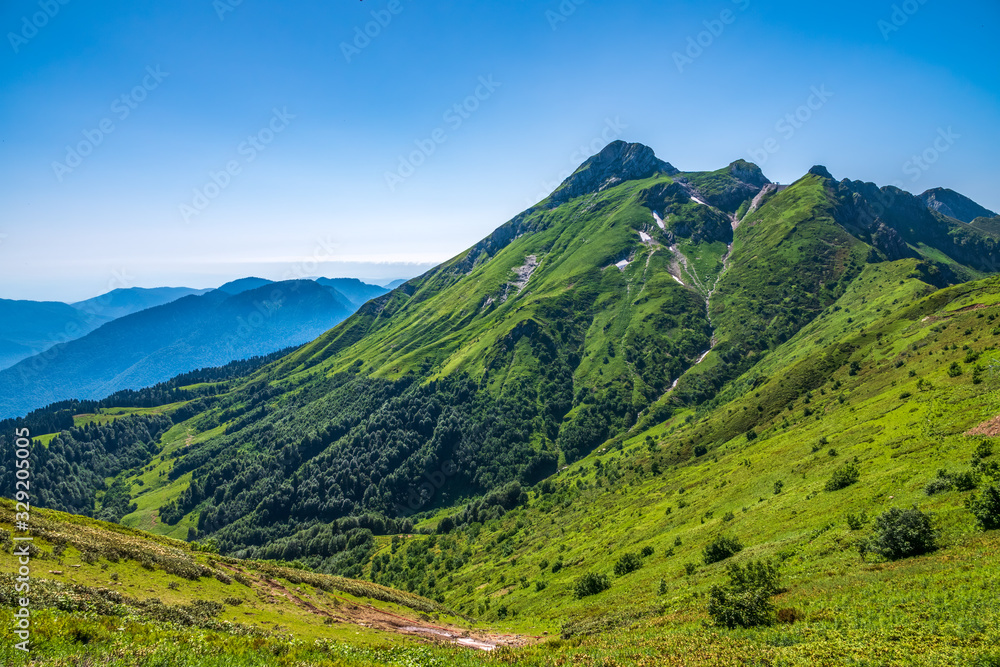 High mountain with green slope. High mountain with green slope.