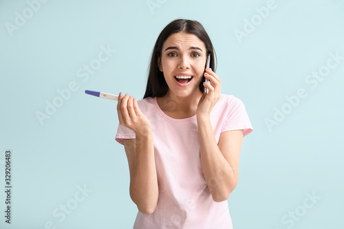 Emotional young woman with ...