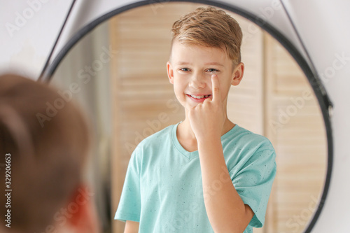 Little boy putting in conta...