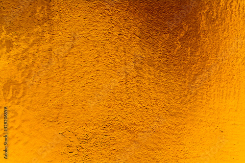 Golden wall plaster glitter texture