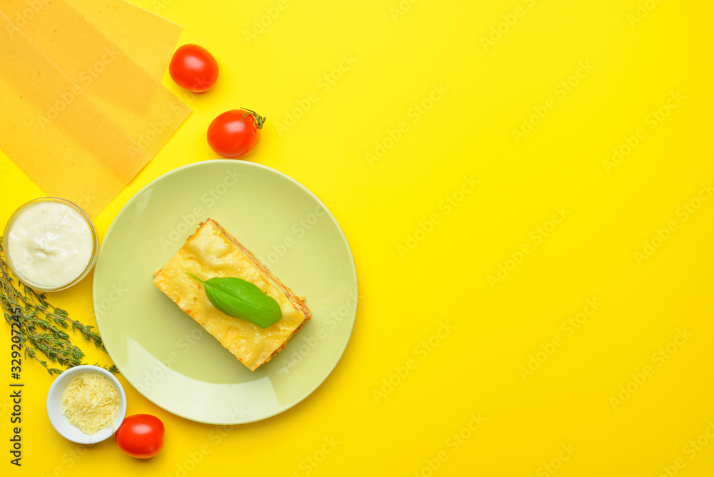 Tasty lasagna with ingredients on color background Tasty lasagna with ingredients on color background