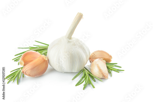 Fresh garlic with herbs on white background