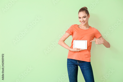 Young woman with tablet com...