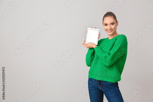 Young woman with tablet com...