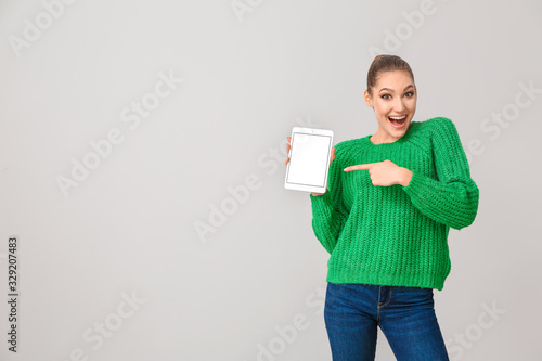 Young woman with tablet com...