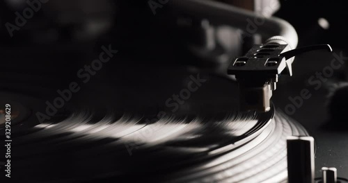 Closeup of a Vinyl Recod Player beeing started, Needle positioned and lowered