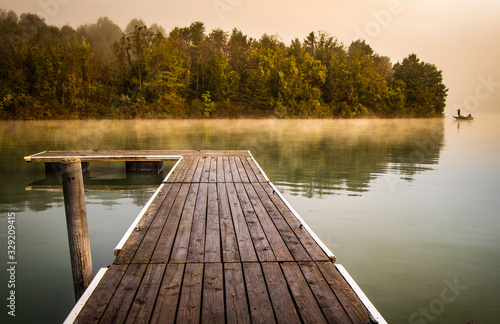 Misty morning pier at the lake