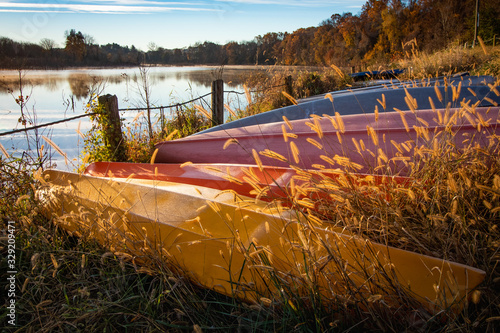 Lakeside canoes in autumn photo