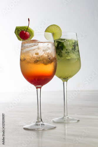 two delicious coktails with lemon and cherry
