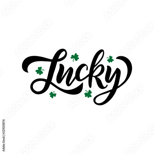 Hand drawn brush faux calligraphy Lucky. St. Patrick's Day celebration typography lettering with green shamrock photo