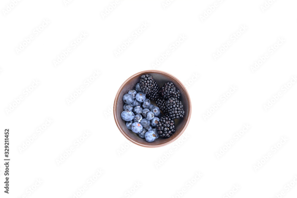 Blueberry and Blackberry on blown cup with white background, fruit concept