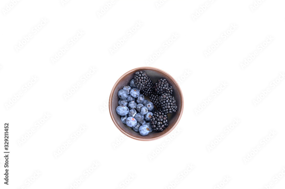 Blueberry and Blackberry on blown cup with white background, fruit concept Blueberry and Blackberry on blown cup with white background, fruit concept