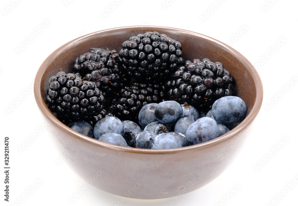 Blueberry and Blackberry on blown cup with white background, fruit concept Blueberry and Blackberry on blown cup with white background, fruit concept