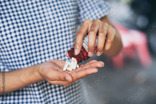 Foto Pills and medicine in woman hands, Hazardous drugs have adverse effects on health