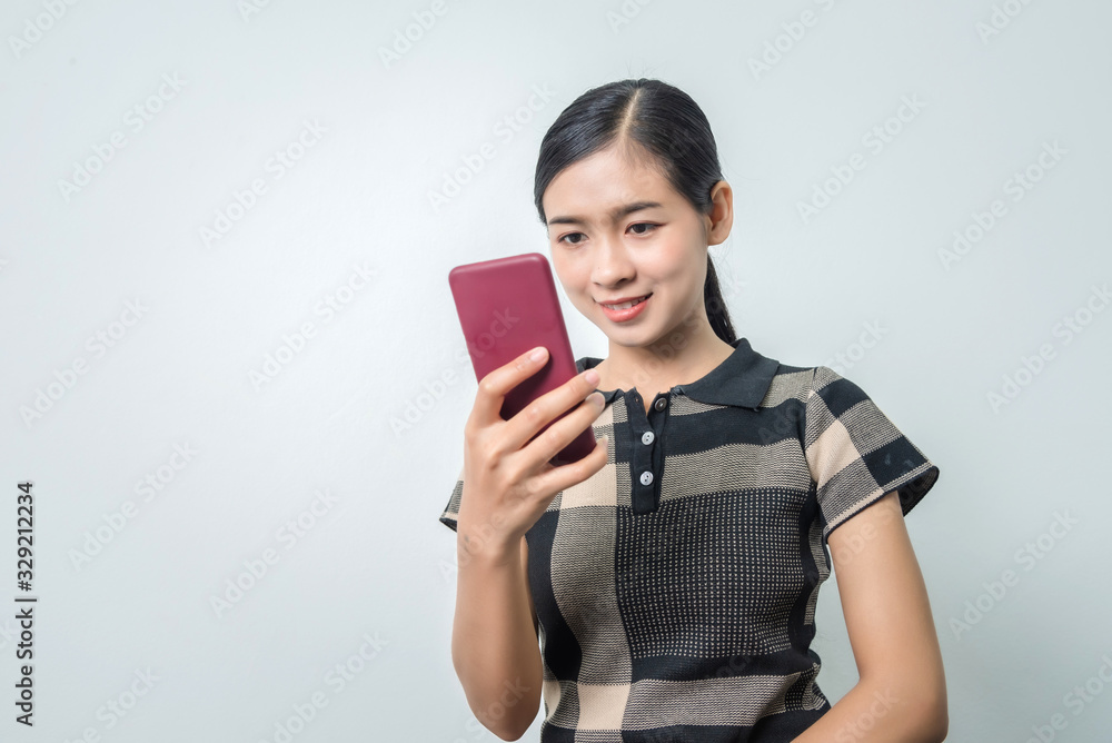 Young asian woman using phone, facial recognition system, biometrics concepts. Young asian woman using phone, facial recognition system, biometrics concepts.