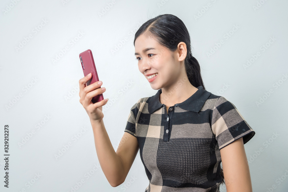 Young asian woman using phone, facial recognition system, biometrics concepts.