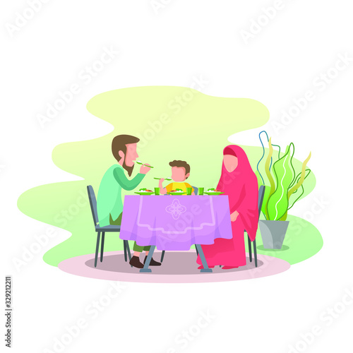 a Muslim family eating together, father gave the example of eating with the right hand and praying before starting eat