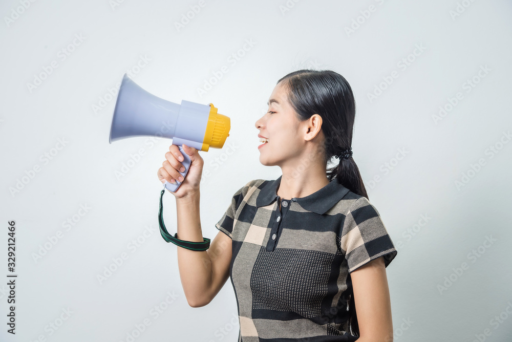 Young beautiful asian woman holding loudspeaker, black hair. Young beautiful asian woman holding loudspeaker, black hair.