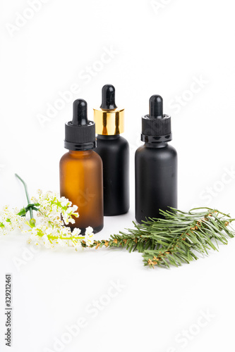Fototapeta Naklejka Na Ścianę i Meble -  Natural  cosmetics concept: Cosmetics with grean leaves isolated on white