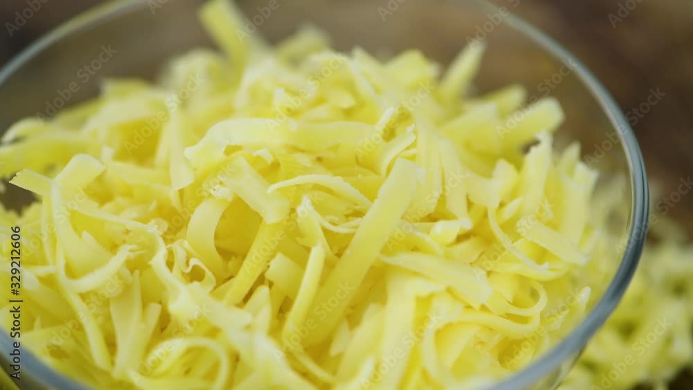Portion of grated Cheese (seamless loopable; 4K) Portion of grated Cheese (seamless loopable; 4K)