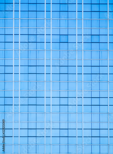 background of modern building architecture wall blue glass glazing in pattern cube and square
