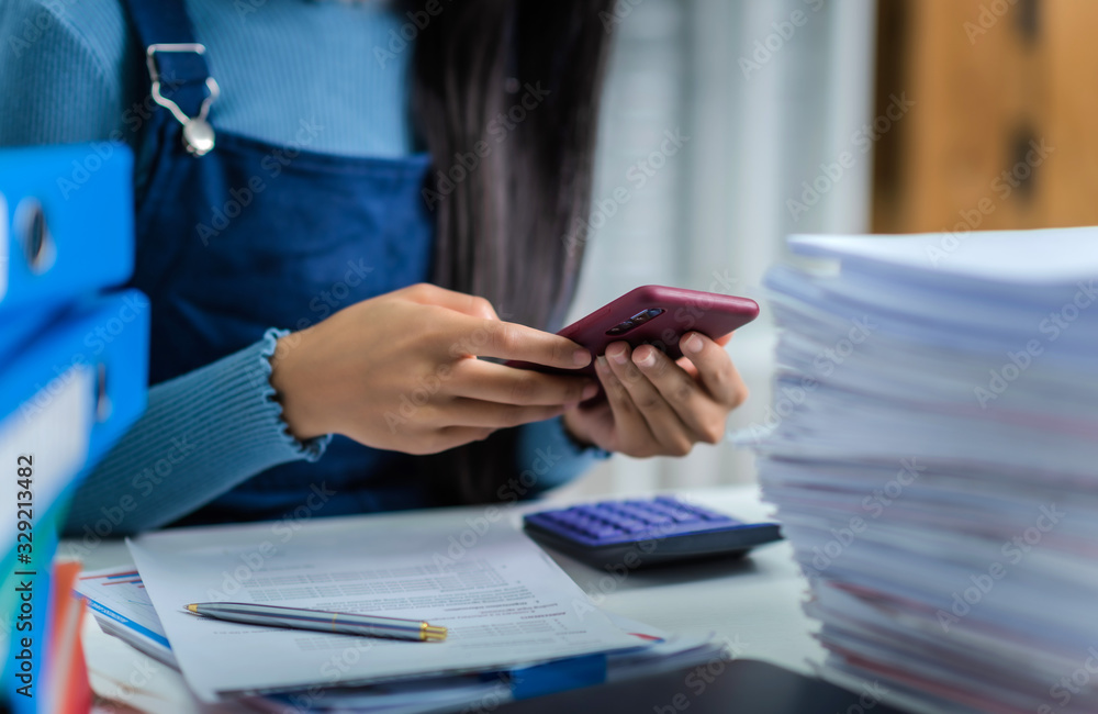 Young woman got tired of working with stack of papers financial reports accountant and tax service. Young woman got tired of working with stack of papers financial reports accountant and tax service.
