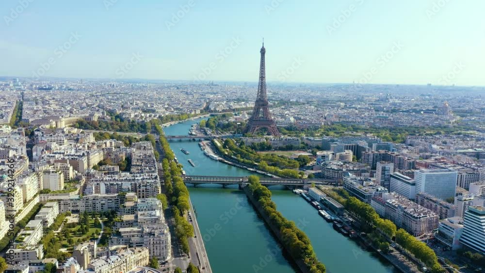 PARIS, FRANCE - MAY, 2019: Aerial drone view of Eiffel tower and Seine river in historical city centre from above. PARIS, FRANCE - MAY, 2019: Aerial drone view of Eiffel tower and Seine river in historical city centre from above.