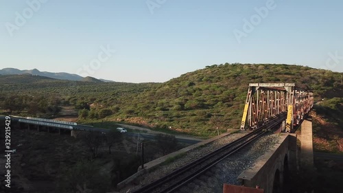 4K aerial drone video view of historical railway bridge on main B6 road from Windhoek to Gobabis and Windhoek Hosea Kutako Airport in central highland Khomas Hochland of Namibia, southern Afric photo