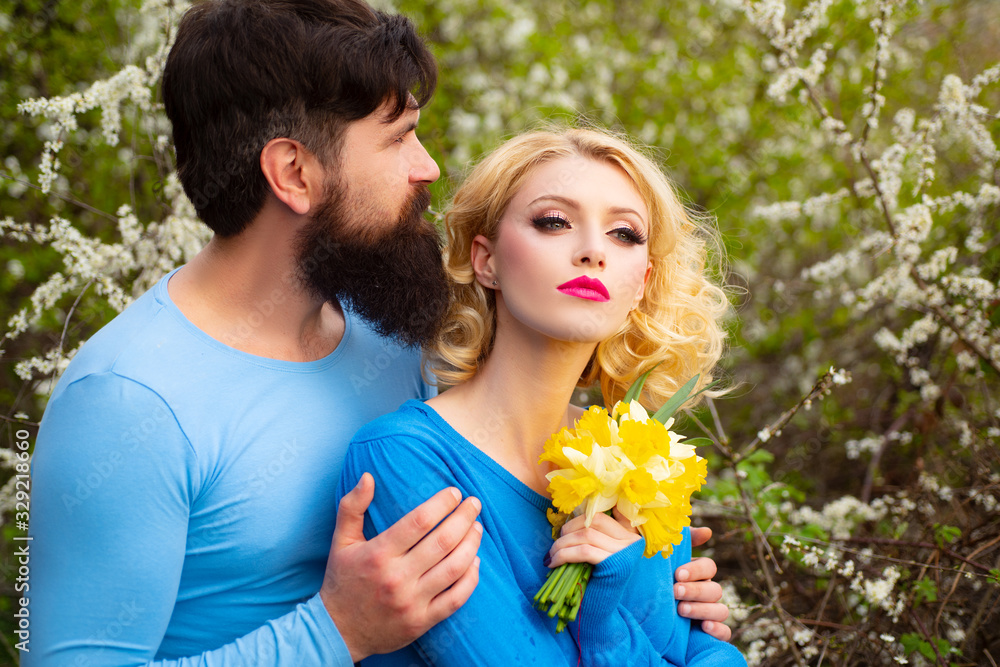 Couple in love enjoying a walk on a sunny spring day. Spring couple. Couple in love enjoying a walk on a sunny spring day. Spring couple.