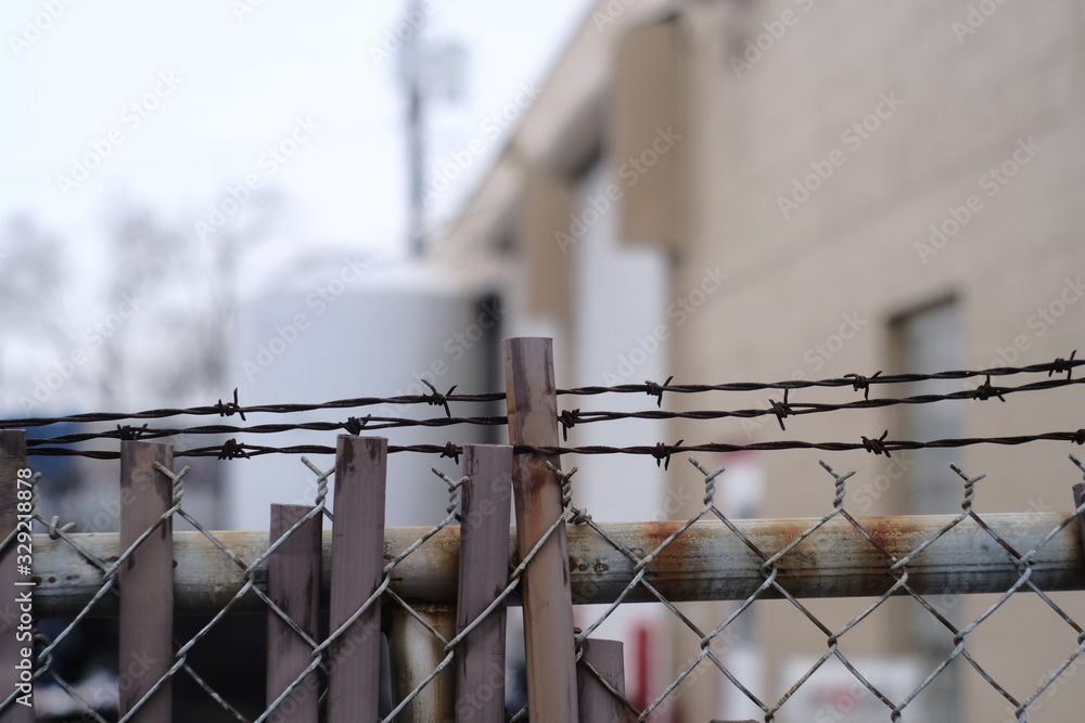 industrial chainlink fence with barbed wire