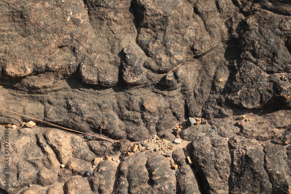 textures and patterns showing the formation of stone from ancient cooled lava flow on rock faces in a volcanic area rural Victoria, Australia. textures and patterns showing the formation of stone from ancient cooled lava flow on rock faces in a volcanic area rural Victoria, Australia.