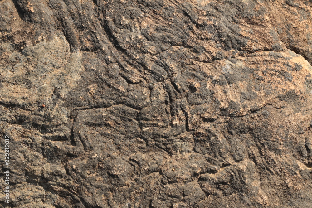 textures and patterns showing the formation of stone from ancient cooled lava flow on rock faces in a volcanic area rural Victoria, Australia. textures and patterns showing the formation of stone from ancient cooled lava flow on rock faces in a volcanic area rural Victoria, Australia.