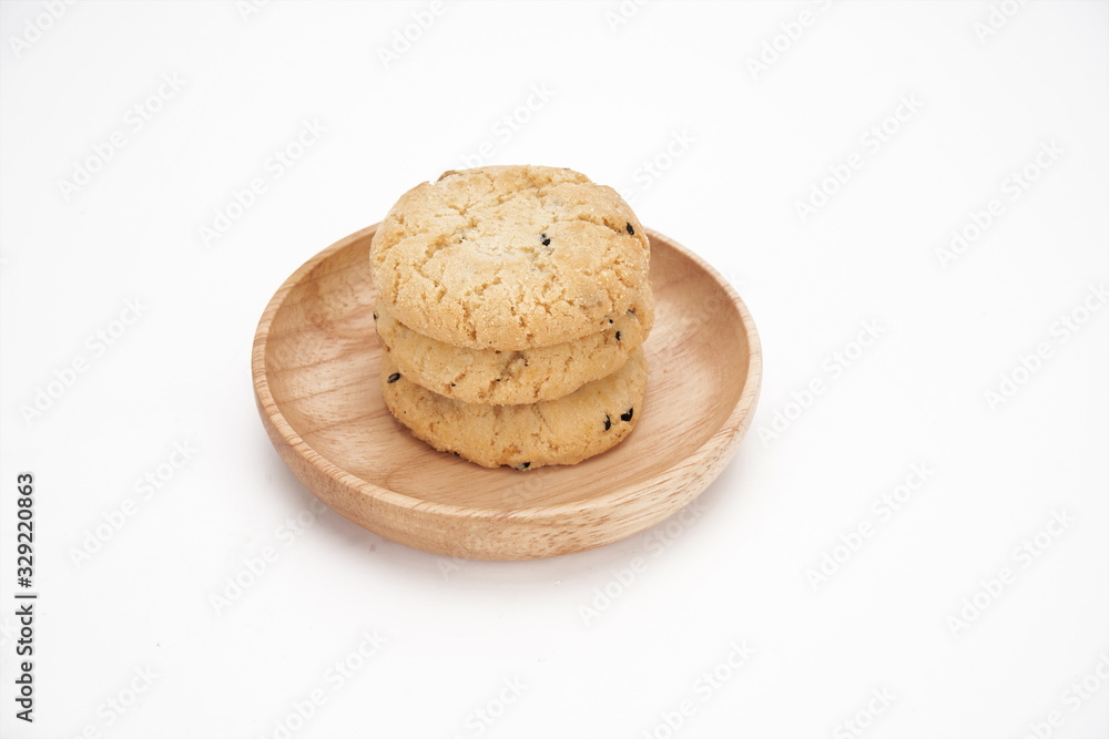 Cookies on a white ceramic plate on the gray kitchen table. Top view with copy space.Chocolate chip cookies isolated on a white background. Cookies homemade cakes. Cookies on a white ceramic plate on the gray kitchen table. Top view with copy space.Chocolate chip cookies isolated on a white background. Cookies homemade cakes.