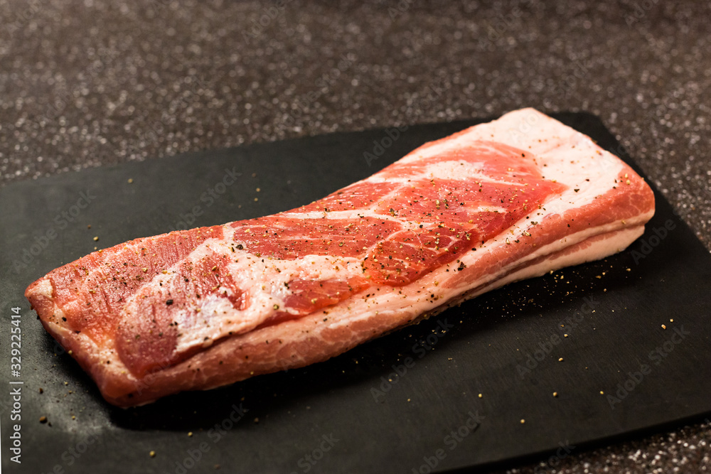 Pork chunks on chopping board