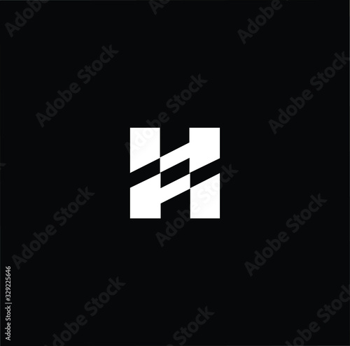 Minimal elegant monogram art logo. Outstanding professional trendy awesome artistic H initial based Alphabet icon logo. Premium Business logo White color on black background
