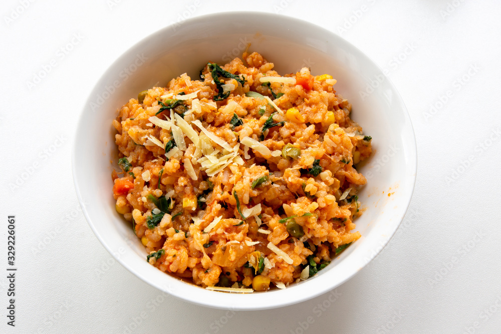 Risotto with tomatoes, fresh herbs and parmesan cheese Risotto with tomatoes, fresh herbs and parmesan cheese