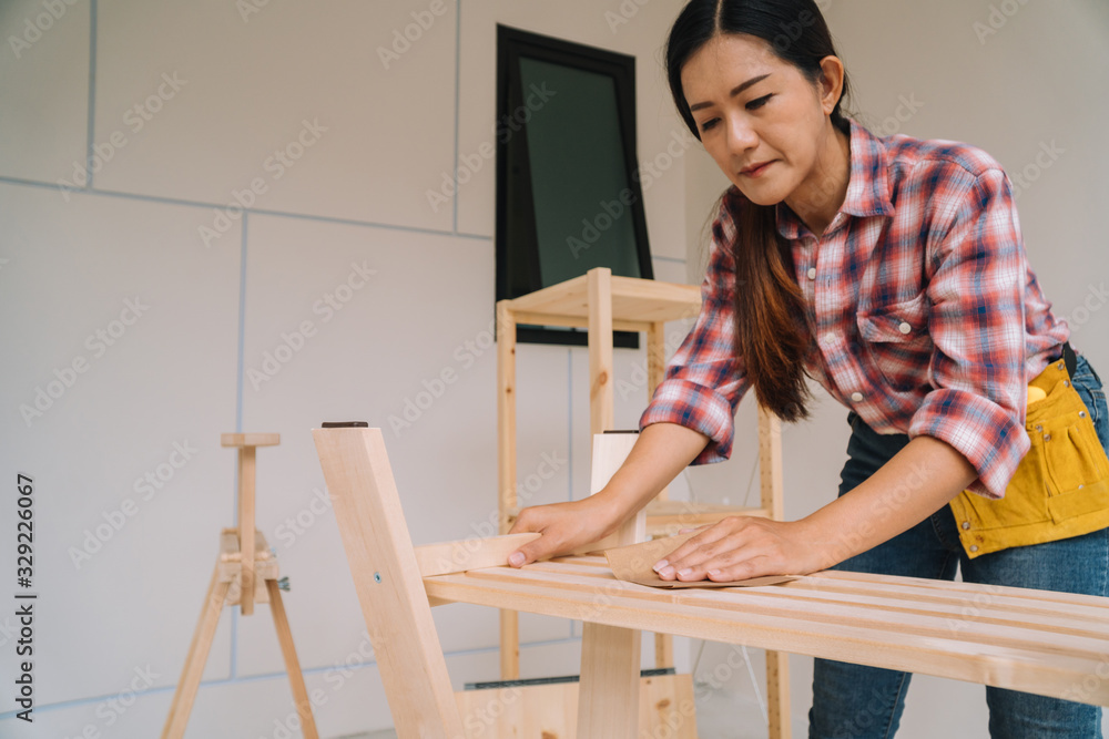 woman worker in the carpenter workroom. woman worker in the carpenter workroom.