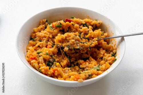 Risotto with tomatoes, fresh herbs and parmesan cheese