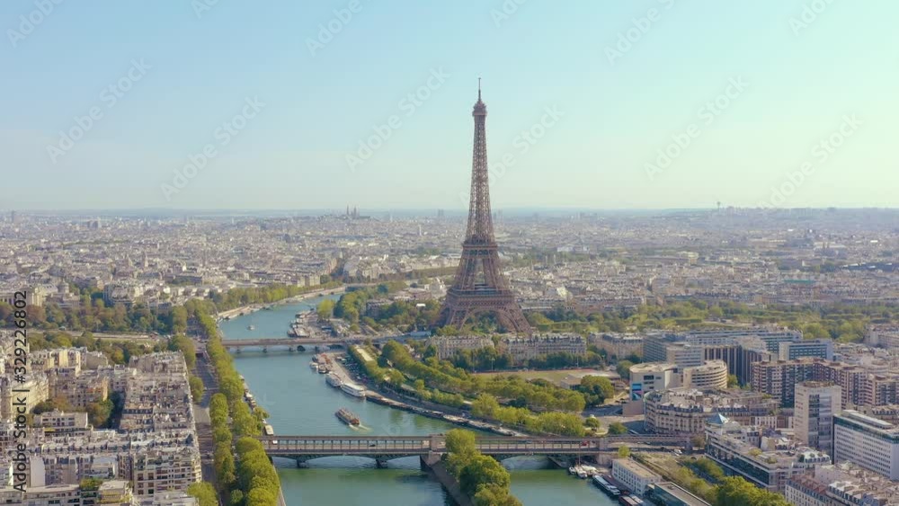 PARIS, FRANCE - MAY, 2019: Aerial drone view of Eiffel tower and Seine river in historical city centre from above.