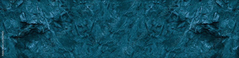 Blue green abstract background. Toned monochrome texture of the mountain. Petrol stone background. Banner with colored stone texture. Marble effect.