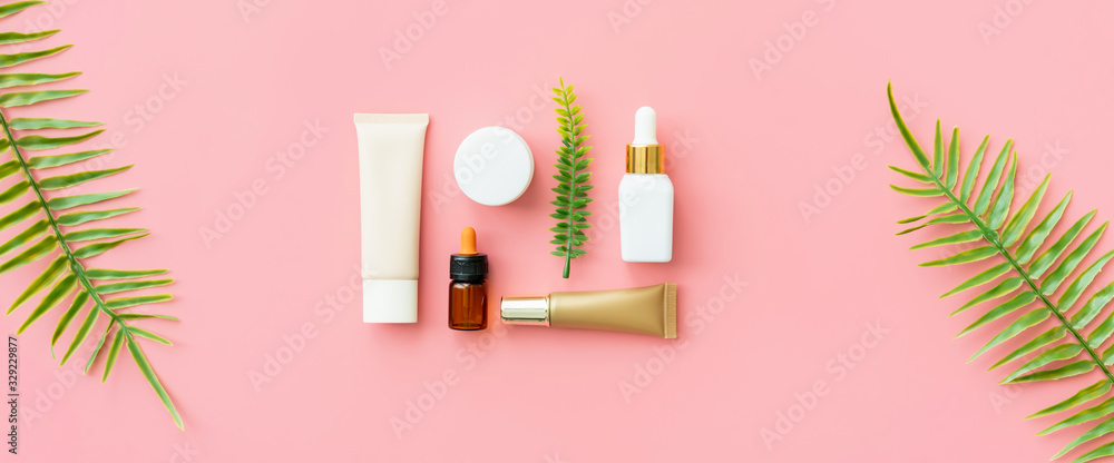 White bottle cream, mockup of beauty product brand. Top view on the pink background. White bottle cream, mockup of beauty product brand. Top view on the pink background.