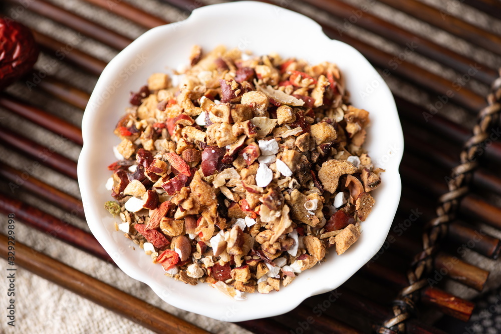 The tea bag made of wolfberry, Maidong, red date, tuckahoe, wolfberry and other traditional Chinese medicines is a health tea often drunk in Asia The tea bag made of wolfberry, Maidong, red date, tuckahoe, wolfberry and other traditional Chinese medicines is a health tea often drunk in Asia