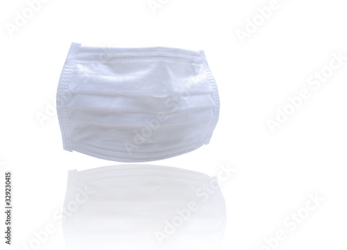 White surgical face mask or medical face mask for prevention coronavirus, flu, and air pollution. Disposable mouth mask with filter isolated on white background. Medical healthcare supply in hospital.