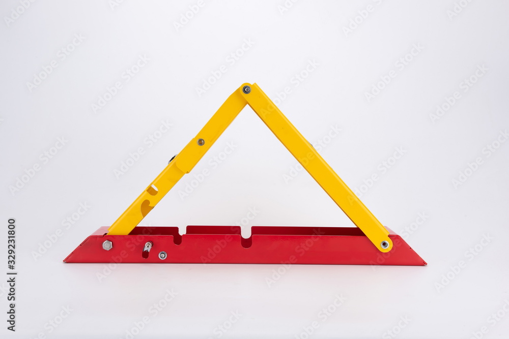 Manual stop barrier with lock and stop sign. Parking lock device. Provide special parking for guests. Traffic rules, no sign. Outdoor empty lock parking lot under white background Manual stop barrier with lock and stop sign. Parking lock device. Provide special parking for guests. Traffic rules, no sign. Outdoor empty lock parking lot under white background