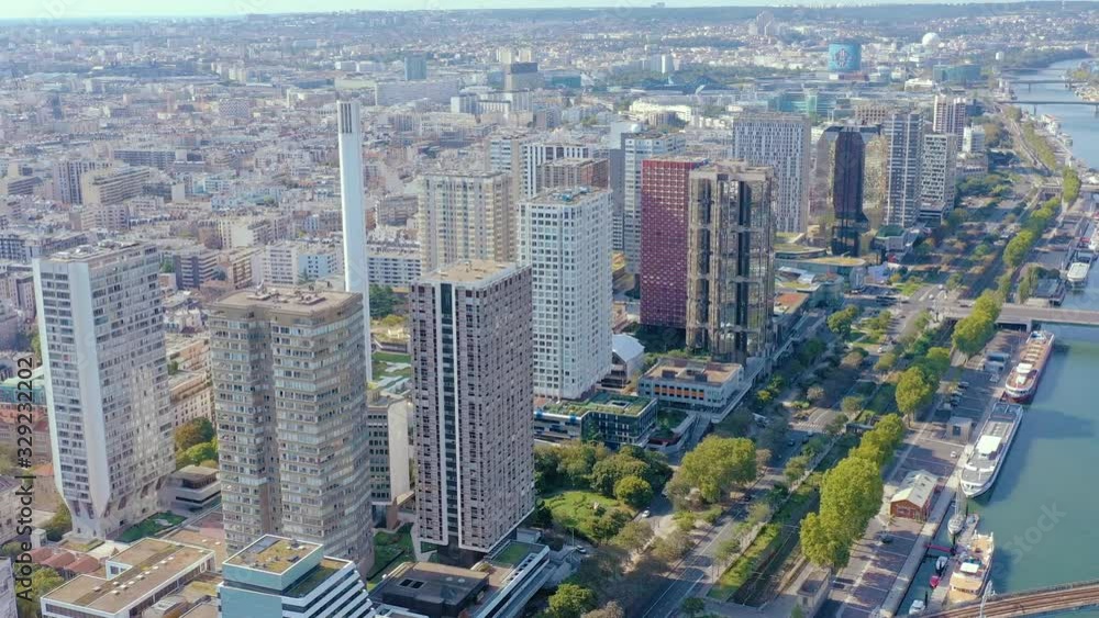 PARIS, FRANCE - MAY, 2019: Aerial drone view of the modern architecture district on Seine riverside in city centre. PARIS, FRANCE - MAY, 2019: Aerial drone view of the modern architecture district on Seine riverside in city centre.