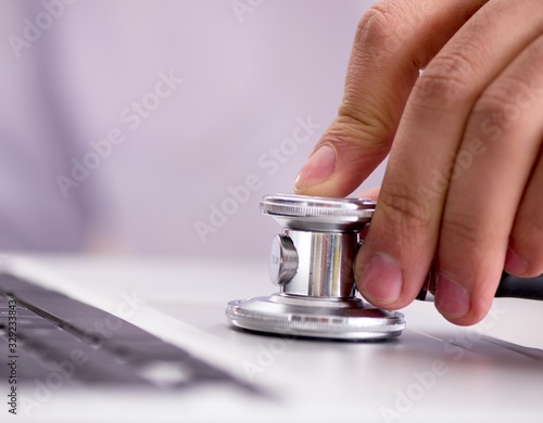 IT technician repairing broken laptop notebook computer