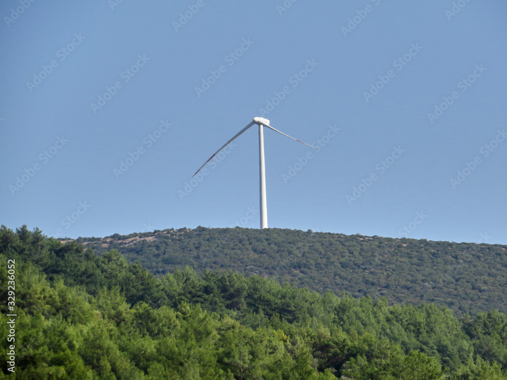 Broken wind turbine  in a wind farm