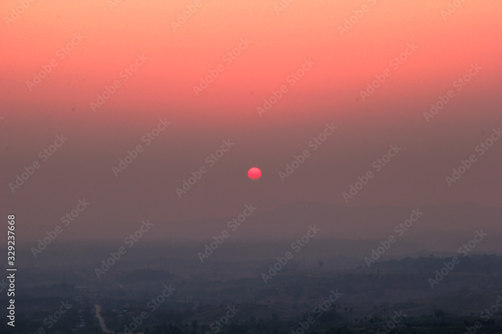 The blurred abstract background of the sun reversing the horizon in the mountains, colorful change over time, the beauty of seasonal nature The blurred abstract background of the sun reversing the horizon in the mountains, colorful change over time, the beauty of seasonal nature