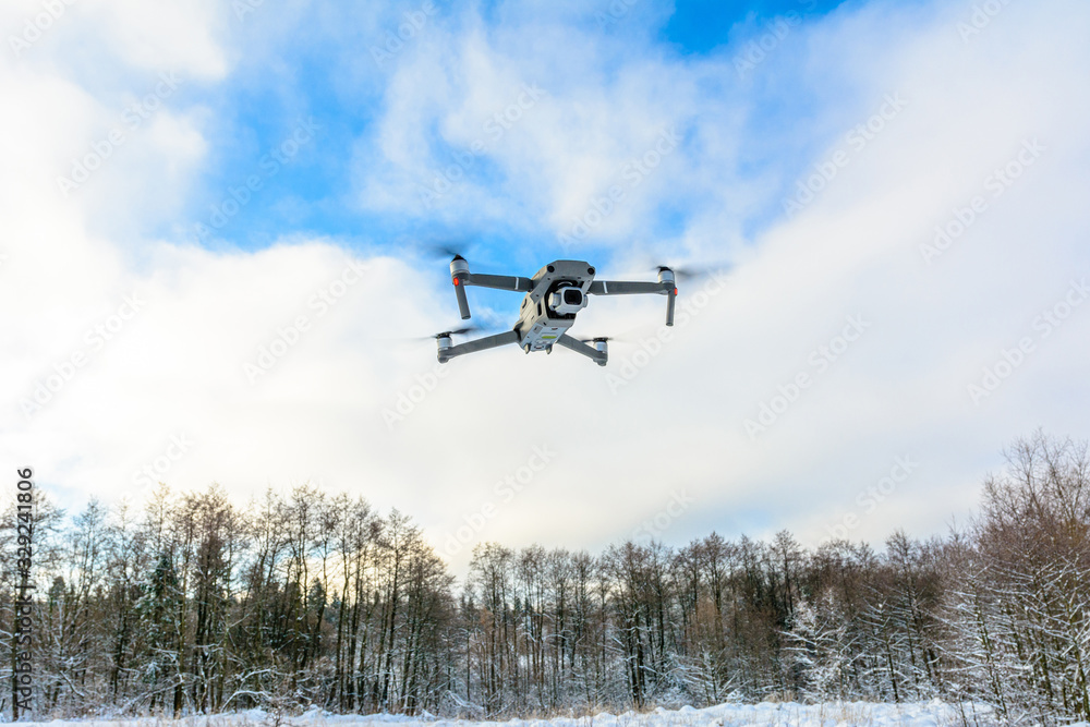 A quadcopter with a built-in camera flies into the sky, captures video footage of the photo. A quadcopter with a built-in camera flies into the sky, captures video footage of the photo.