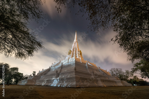 The scenery of Wat Phu Khao Thong  Golden Mount  temple with cloudy in starry night in Ayutthaya province  Thailand.